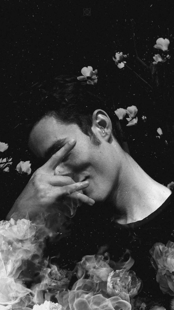 Black and white portrait with flowers and smoke