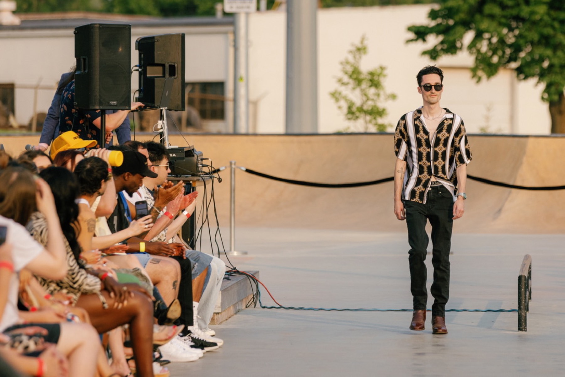 Christian Holman walking a runway built inside a skate park
