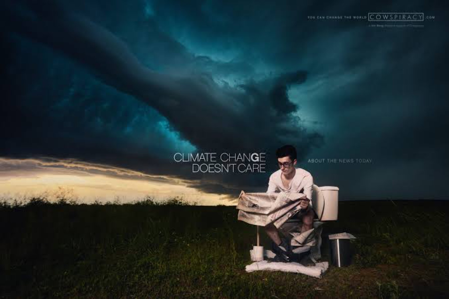 A man on a toilet reading a newspaper as a supercell fills the sky behind him